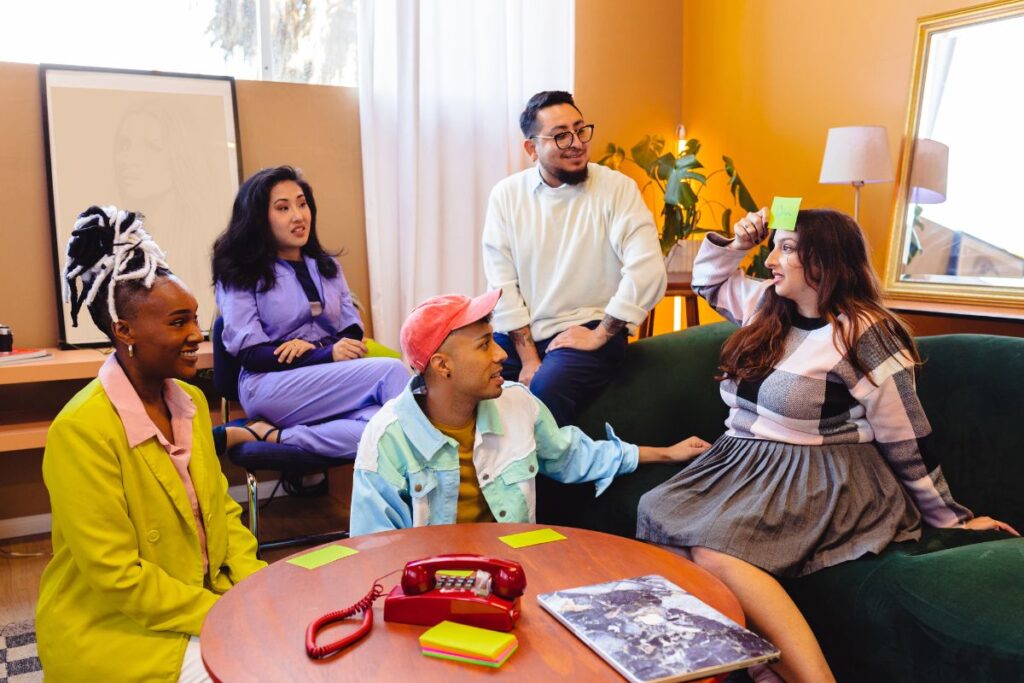 a group of colleagues play 'guess who' in a breakout room