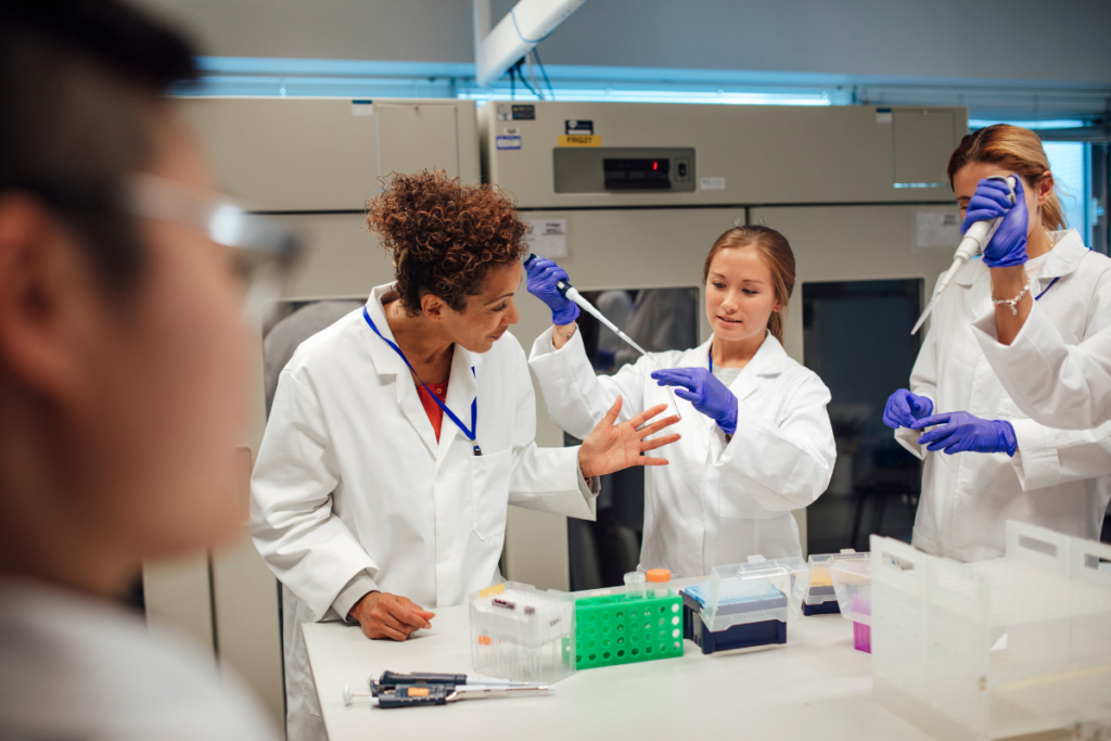 Three women work in a lab together