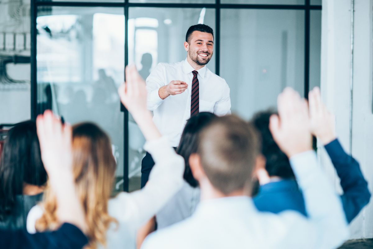 A man hosts an employee training programme.