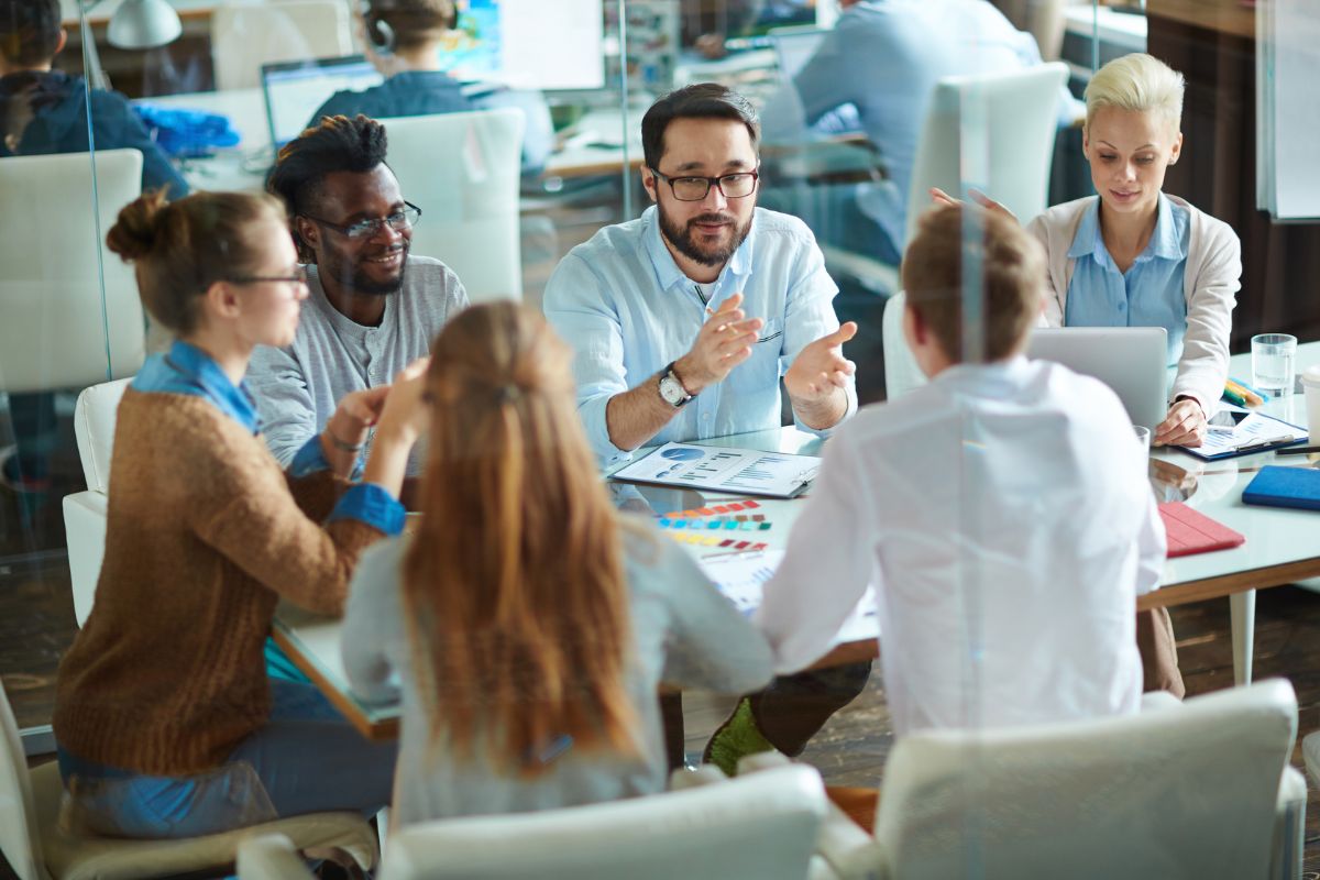 A team of employees have a meeting together