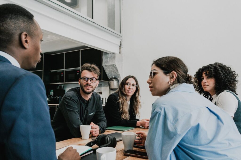 A group of professionals take part in a sales meeting 