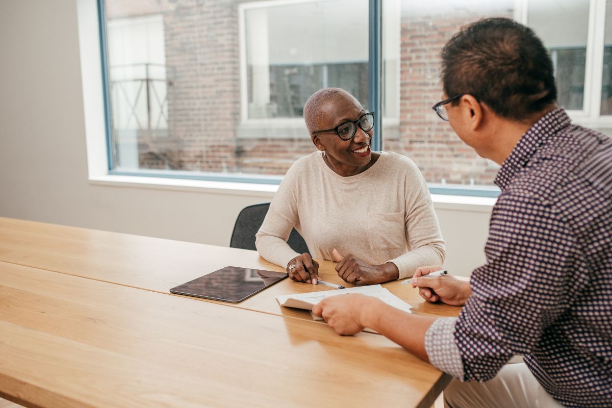 A happy client talks with their partner
