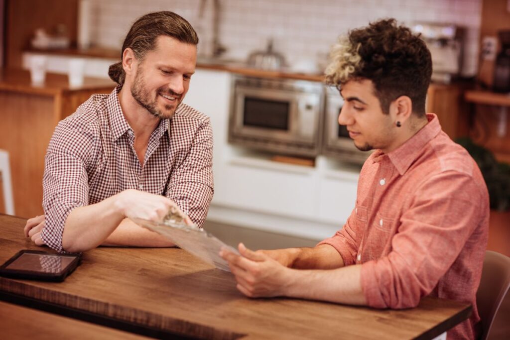 two men discuss the terms of a letting agreement